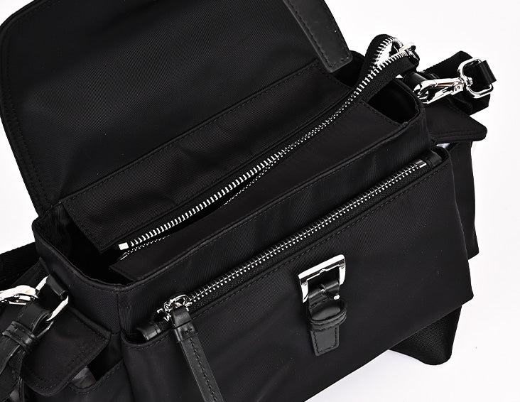 Detailed view of Prada-style nylon messenger bag interior storage pockets and organizers