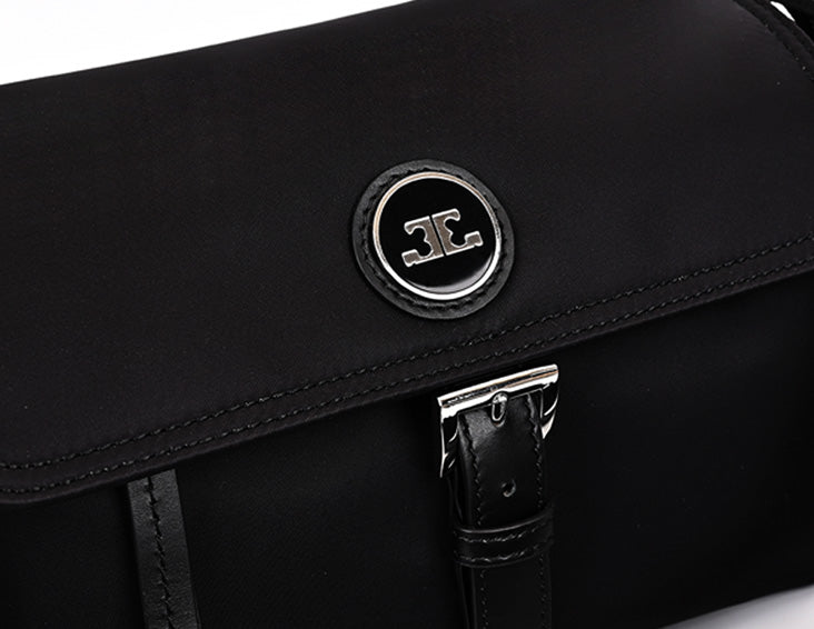 Interior view of black nylon hobo bag with multiple zipper pockets and organized storage compartments