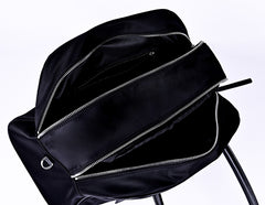 Black nylon commuter tote bag interior showing large capacity with multiple zipper pockets and organized storage compartments